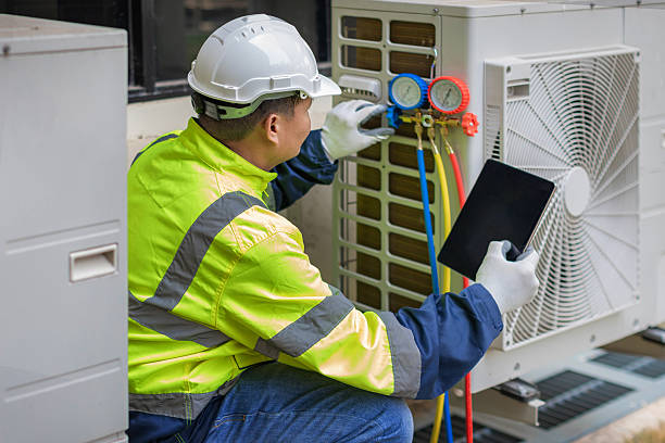 Professional Heat Pump Repair technician working in Parkville, MD